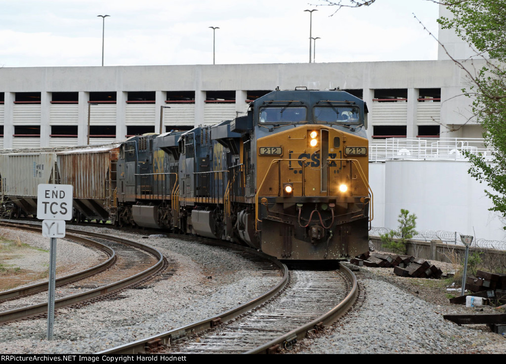 CSX 212 leads train F741-25 out of the yard